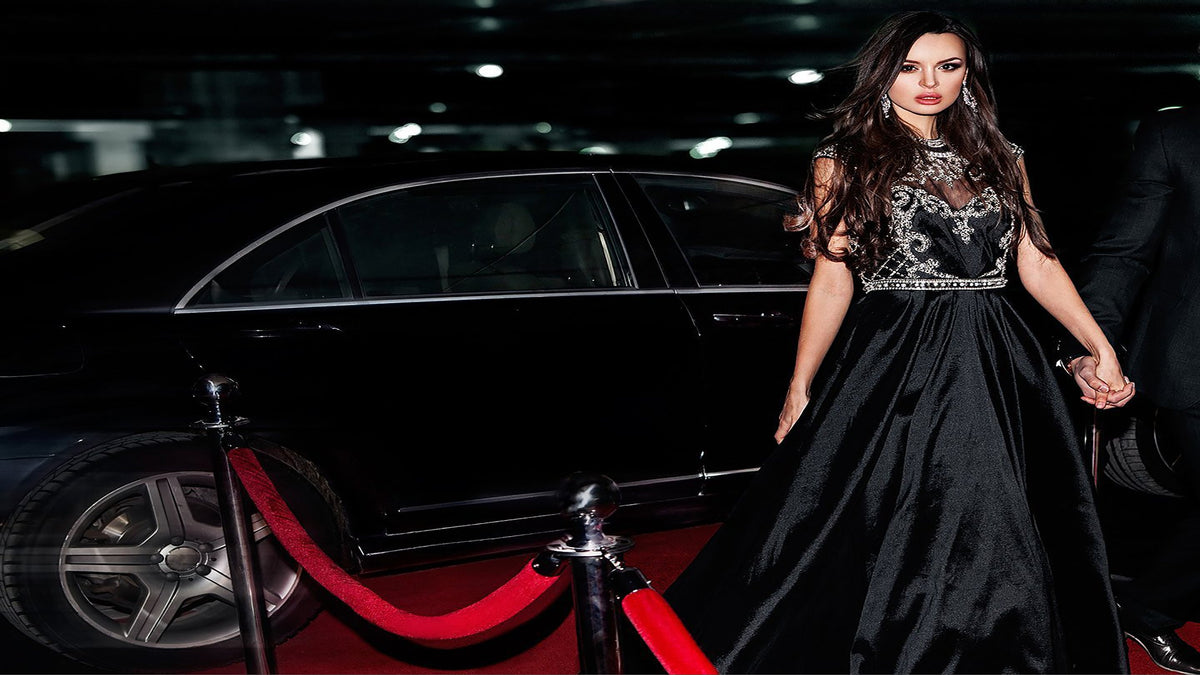 Stunning woman in evening gown exiting a limo in Monte Carlo