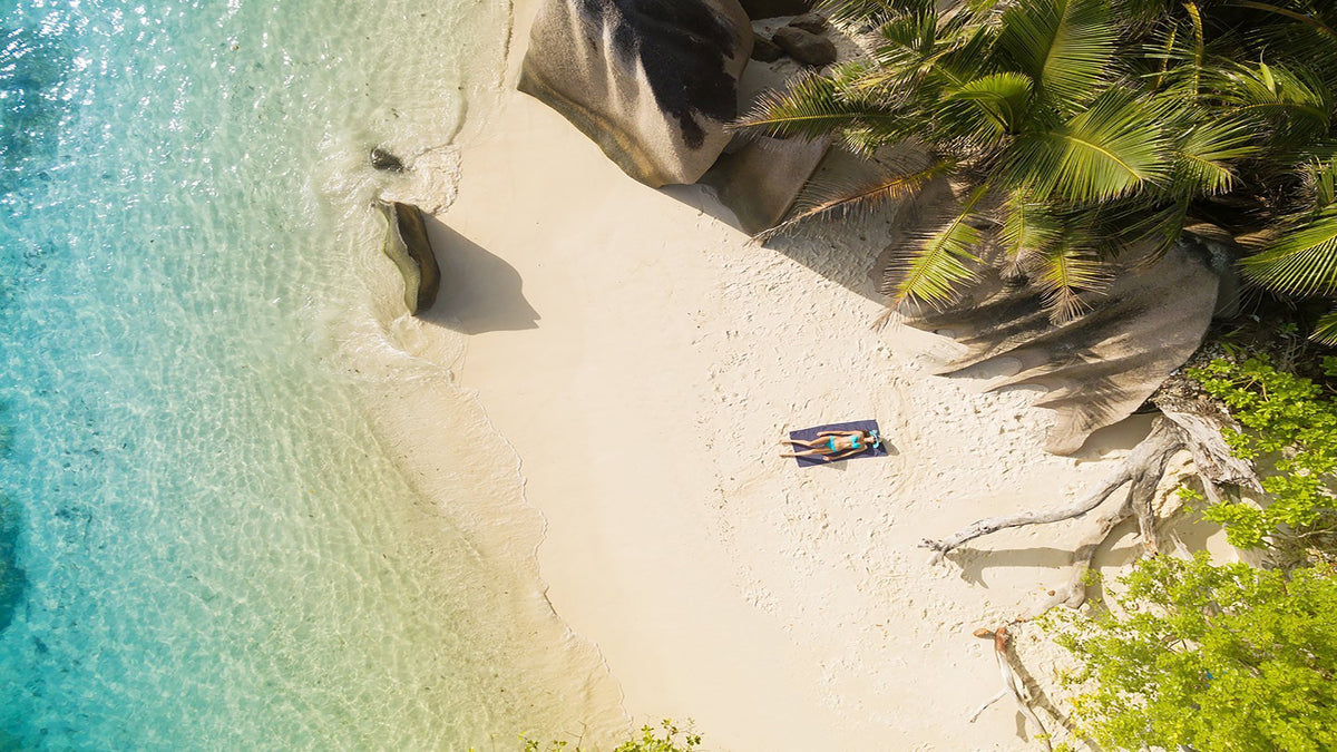 Image of woman relaxing on the beach